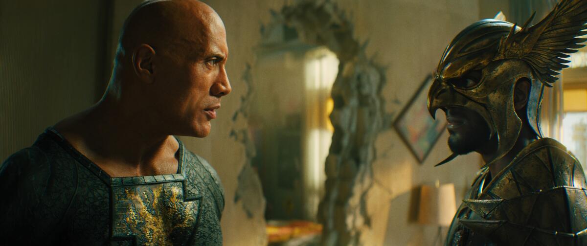 Dwayne Johnson confronts a man in a mask and armor