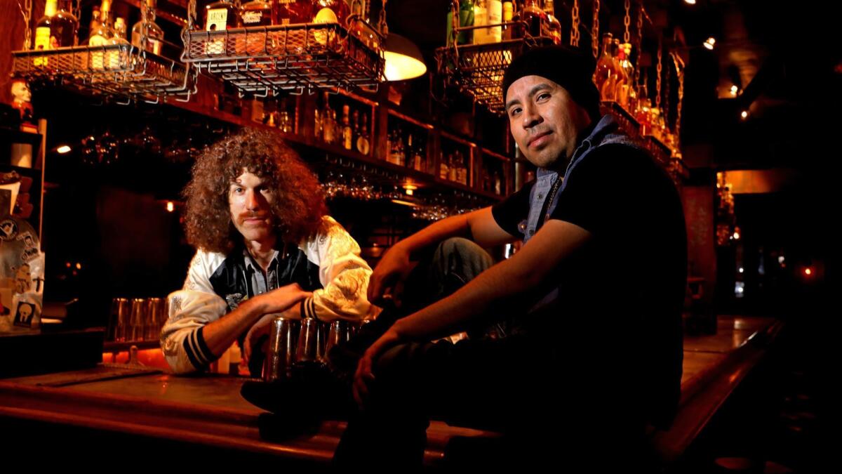 Bar manager Aaron Polsky, left, and bartender Fredy Garcia at Harvard & Stone in Los Angeles.