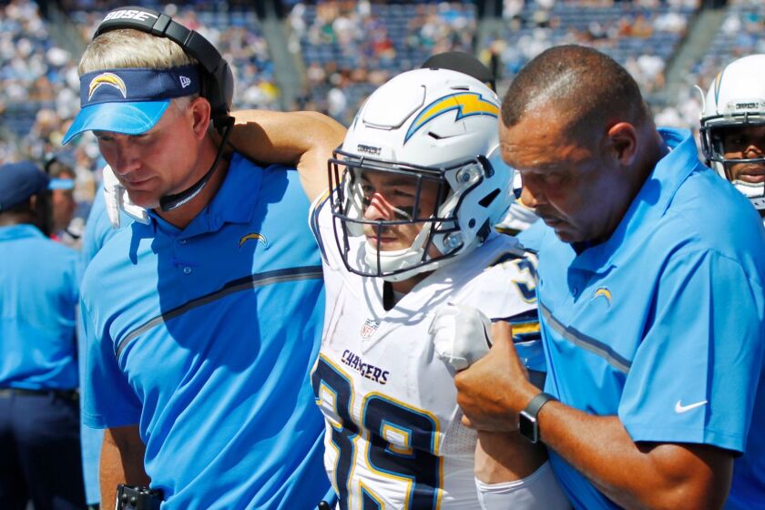 SAN DIEGO, CA - SEPTEMBER 18, 2016 - | Chargers Danny Woodhead is helped off the field by Mike McCoy and James Collins in the 1st quarter after getting injured on a play. | (Photo by K.C. Alfred/The San Diego Union-Tribune)