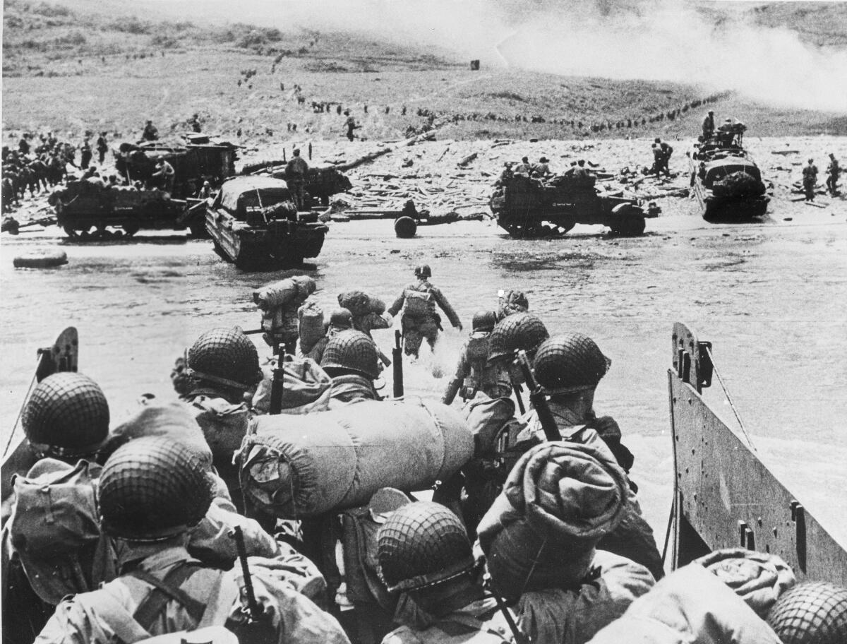 American soldiers and supplies arrive on the shore of Normandy 