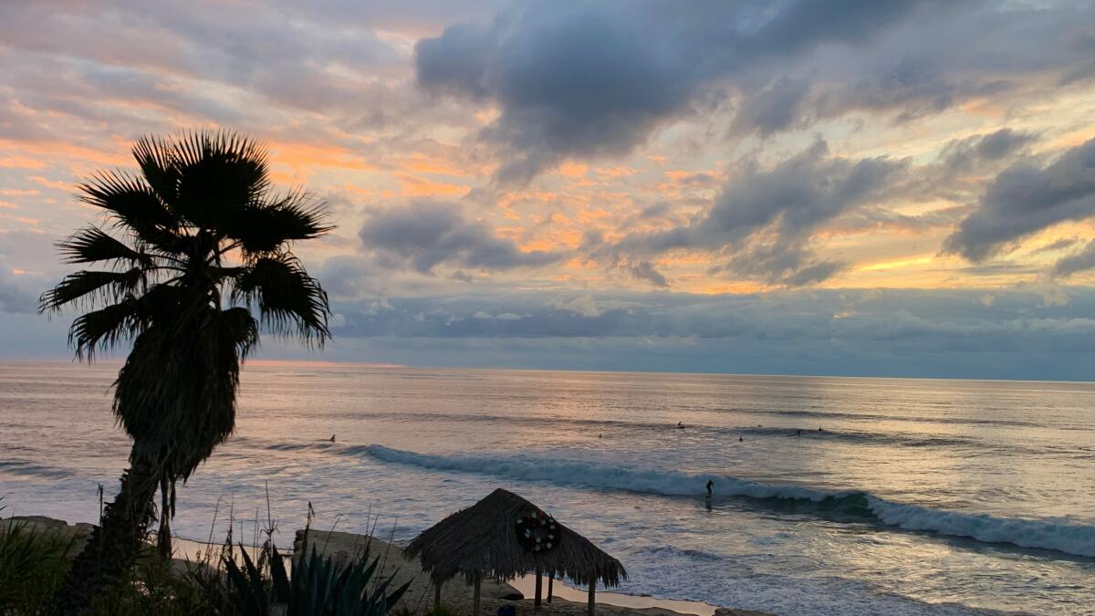 Surfers catch their final waves of the day at Windansea Beach in La Jolla.