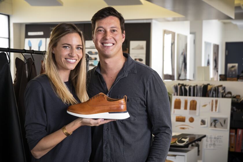 EL SEGUNDO, CA, JANUARY 23, 2020 - Justin Schneider, Founder and CEO and Hope Schneider, Co-founder and Head of Marketing, pictured with the Crossover Longwing in Honey, January 23, 2020. Wolf & Shepherd uses sneaker technology in a dress shoe. The concept behind Wolf & Shepherd is simple: quality footwear that supports your active lifestyle. With full-grain Italian leathers, classic silhouettes and the high-level craftsmanship you expect from luxury dress shoes, polished, professional style has never felt this good. (Photo By Ricardo DeAratanha / Los Angeles Times)