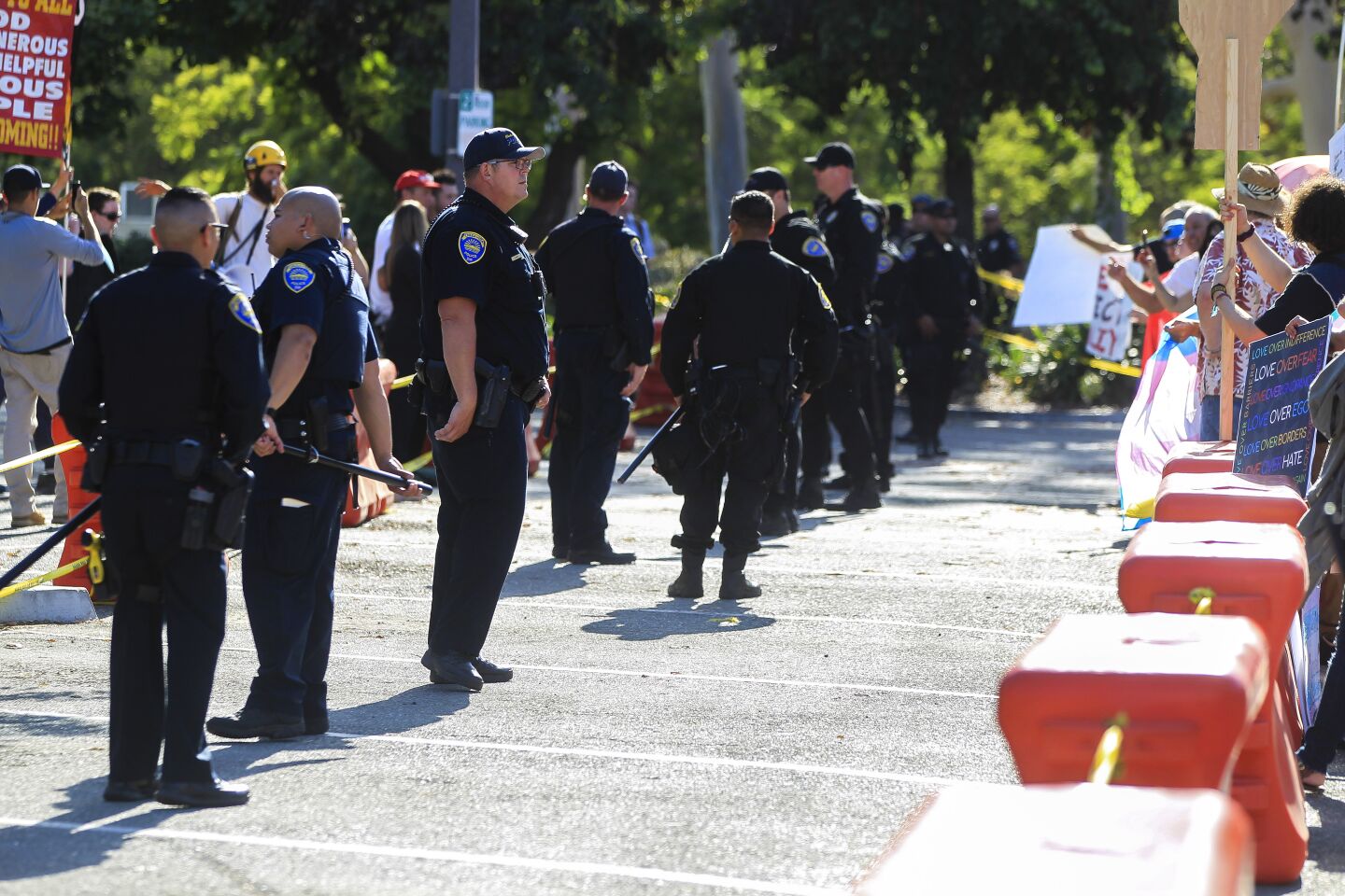 Chula Vista police stand between supporters of the Drag Queen Story Hour and protesters against the story hour at the Chula Vista Public Library Civic Center Branch on Tuesday, September 10, 2019 in Chula Vista, California.