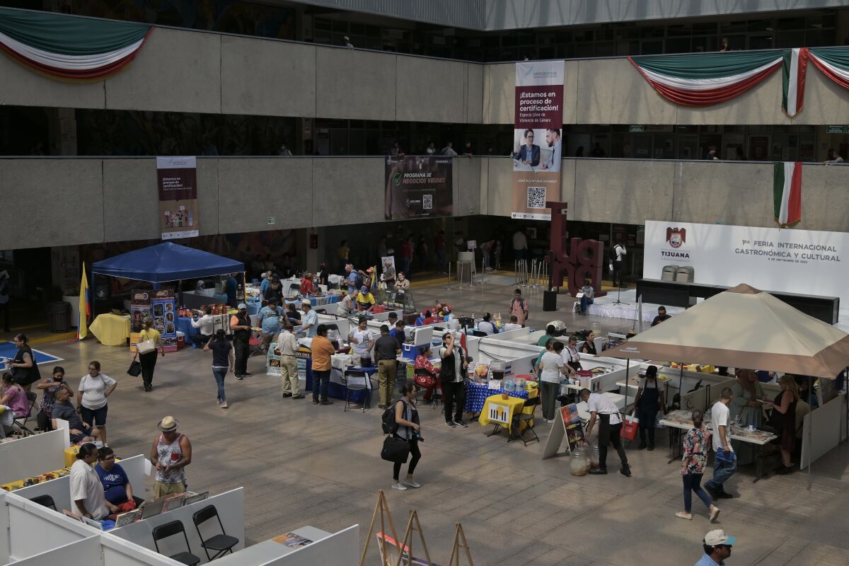 Migrants cook their ethnic foods on Sept. 7 at the 1st International Gastronomic and Culture Fair in Tijuana.