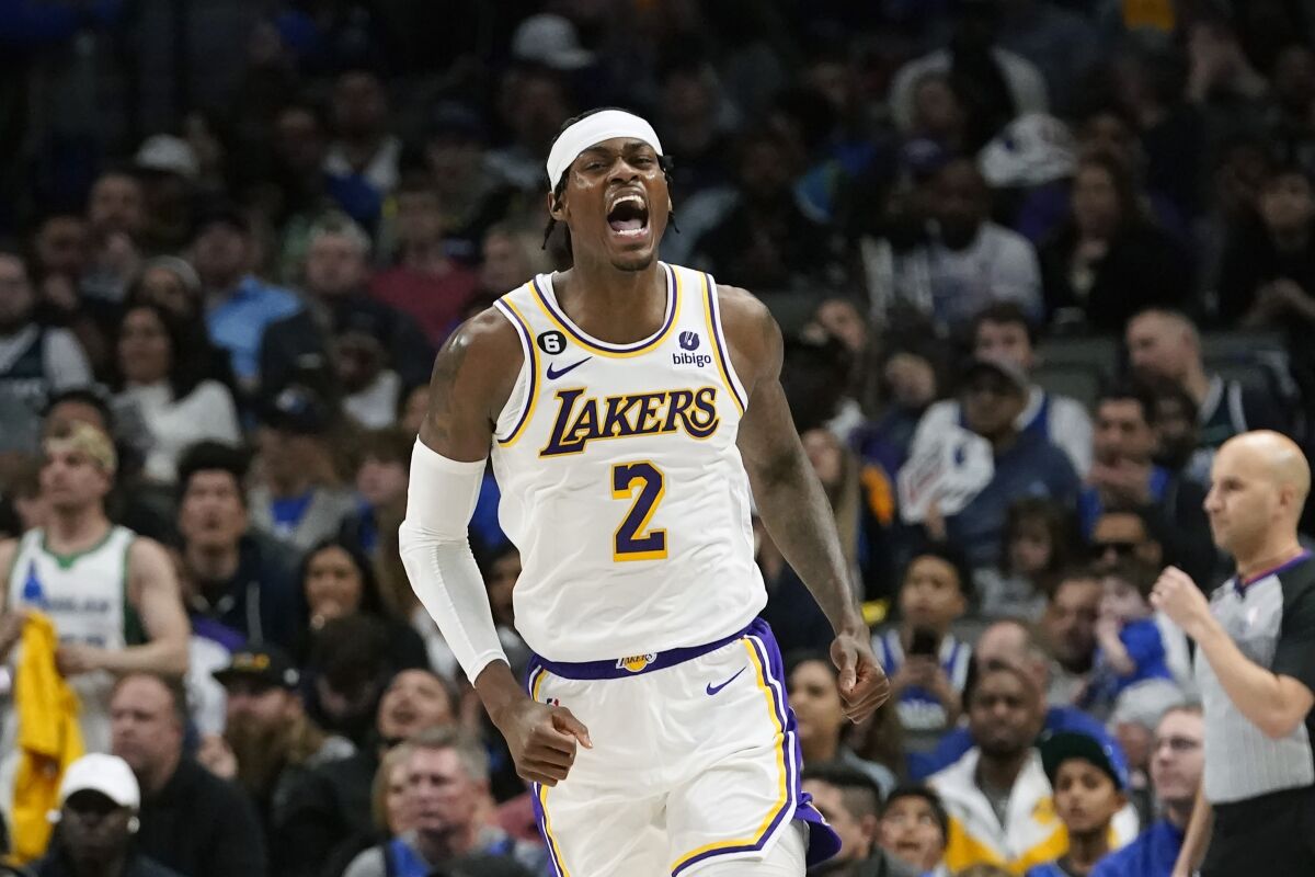 Lakers forward Jarred Vanderbilt lets out a yell after scoring against Dallas on Sunday.