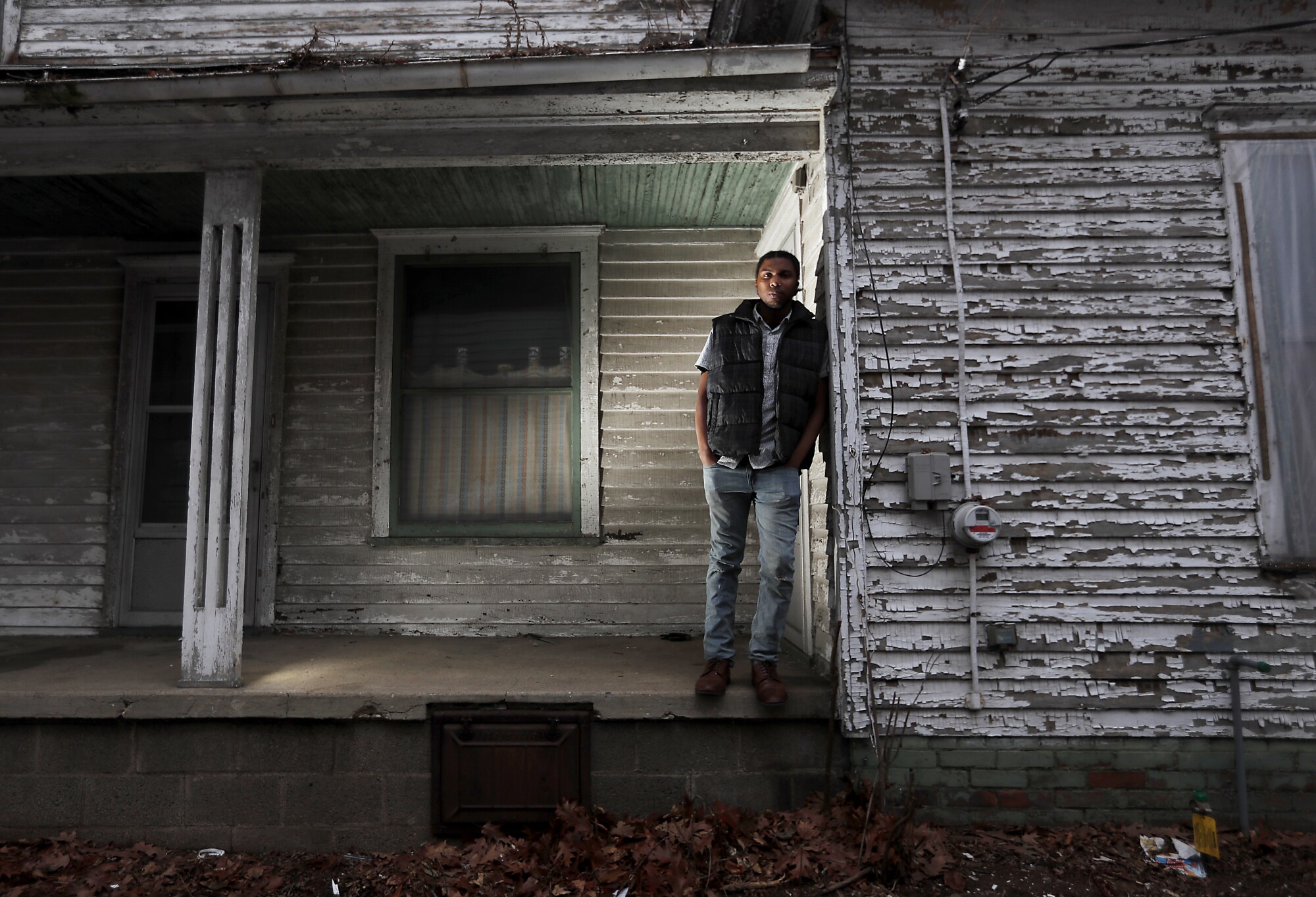 Jorden Giger, 28, a teacher and Black Lives Matter activist, outside a vacant house in the Near Northwest Neighborhood of South Bend, Ind.