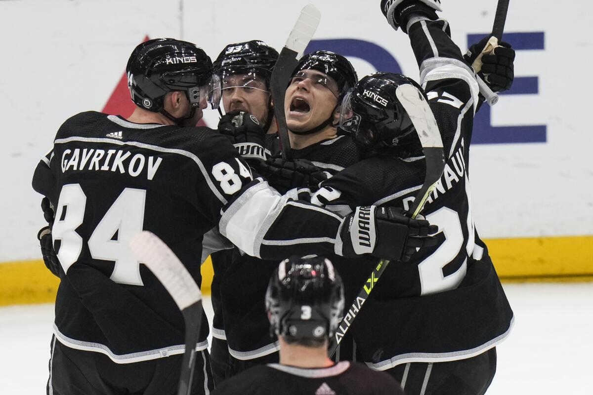 Los Angeles Kings' Trevor Moore, center right, celebrates his goal against the New York Islanders on March 14, 2023.