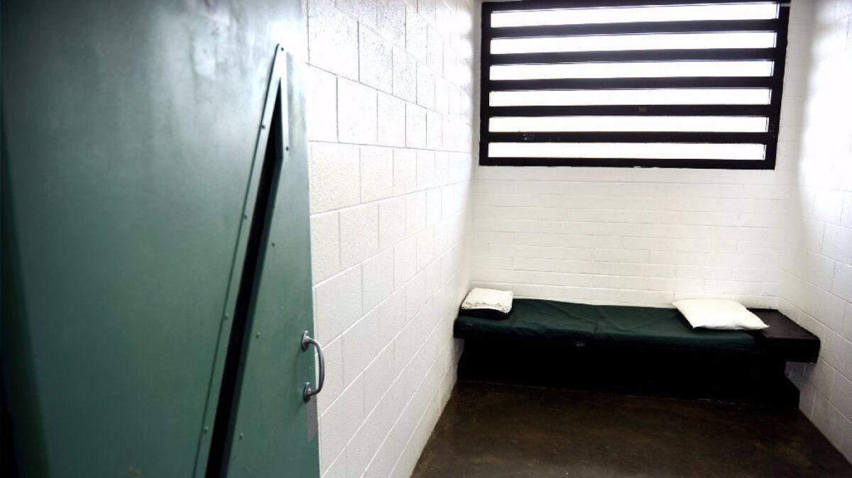 An empty solitary confinement cell at the Barry J. Nidorf Juvenile Hall in Sylmar. A probation officer has been charged with beating teenagers at the facility last year, prosecutors said.