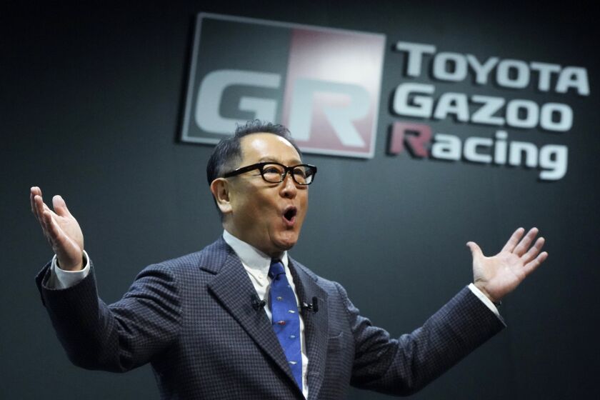 Toyota Motor Corp. Chief Executive Akio Toyoda delivers a speech on the stage at the Tokyo Auto Salon, an industry event similar to the world's auto shows Friday, Jan. 13, 2023, in Chiba near Tokyo. (AP Photo/Eugene Hoshiko)