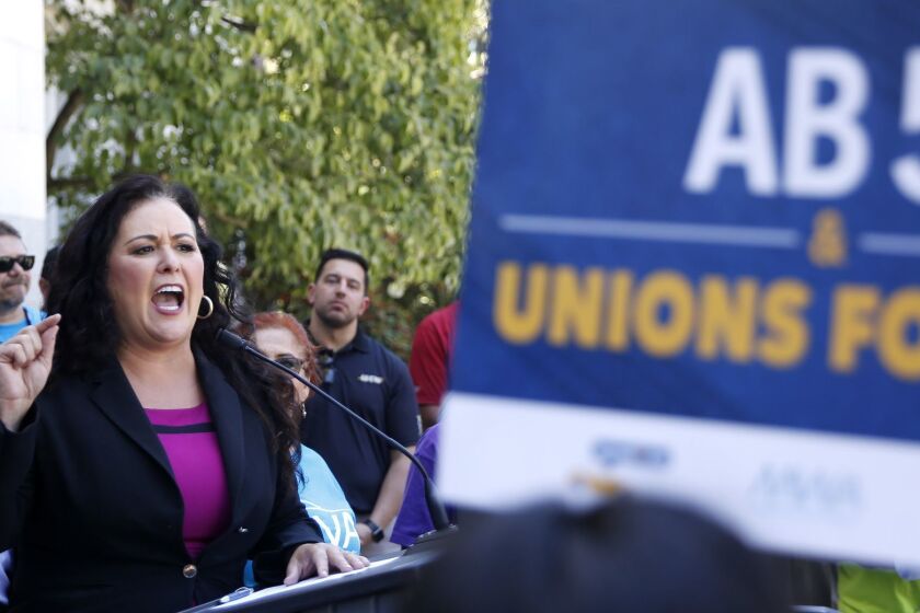 Assemblywoman Lorena Gonzalez, D-San Diego, speaks at a rally after her measure to limit when companies can label workers as independent contractors was approved by a Senate committee, in Sacramento, Calif., Wednesday, July 10, 2019. The measure, AB5, is aimed a major employers like Uber and Lyft. (AP Photo/Rich Pedroncelli)