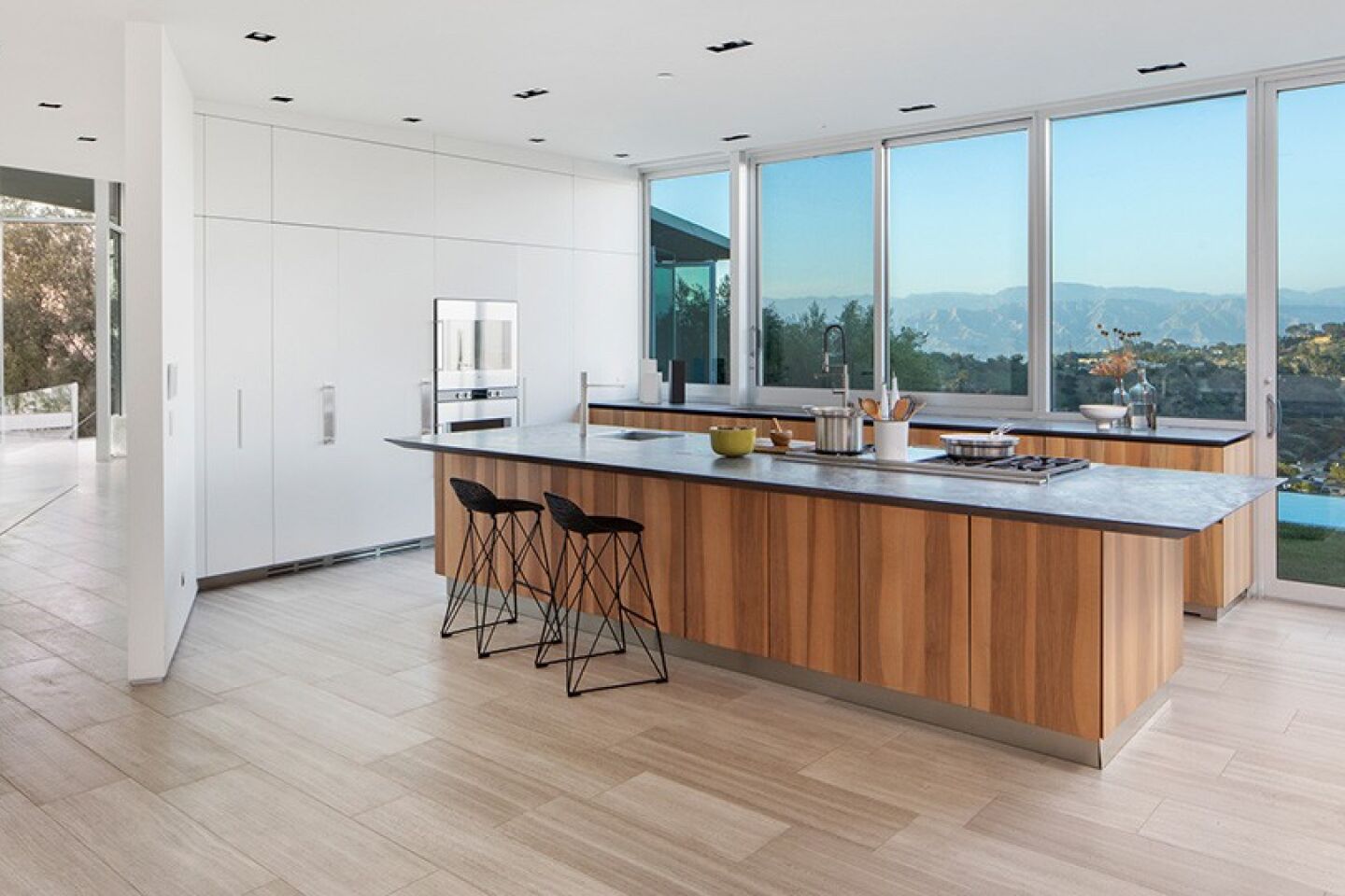 The kitchen has an island and views of the outdoors.