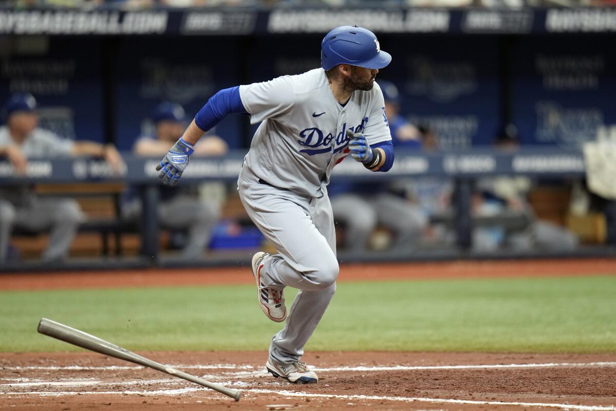 J.D. Martinez hits a run-scoring single in the third inning Sunday.