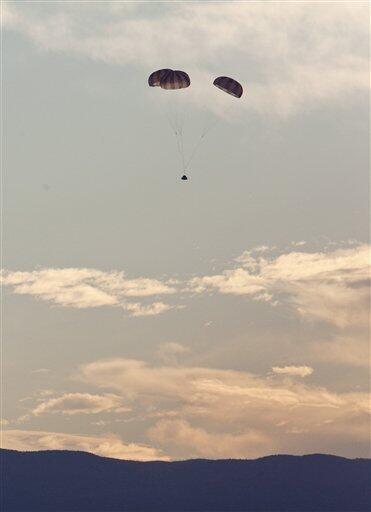 The new Orion crew capsule with parachutes deployed is shown after it was catapulted into the air on Thursday, May 6, 2010 at White Sands Missile Range, N.M., during a test of Orion's launch-abort system, which will whisk astronauts and the capsule to safety in case of a problem on the launch pad,