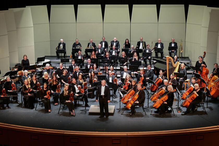 The Poway Symphony Orchestra, with conductor John LoPiccolo, center.