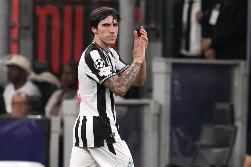 FILE - Newcastle's Sandro Tonali applauds as he leaves the pitch during the Champions League group F soccer match between AC Milan and Newcastle at the San Siro stadium in Milan, Italy, on Sept. 19, 2023. Newcastle midfielder Sandro Tonali has been handed a two-month suspended ban for breaching English soccer's betting rules, the Football Association announced on Thursday, May 2, 2024. Tonali is already serving a 10-month ban issued by the Italian soccer federation for betting on teams he played for, which has ruled him out of action since October. (AP Photo/Antonio Calanni, File)