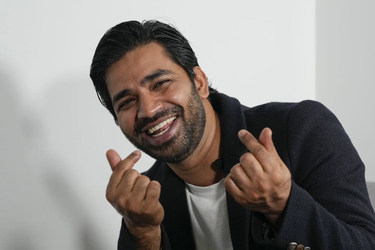Indian actor Anupam Tripathi, who starred in the Netflix series "Squid Game", gestures during an interview in Seoul, South Korea, Thursday, Nov. 18, 2021. Tripathi was named one of AP's breakthrough entertainers of the year. (AP Photo/Ahn Young-joon).