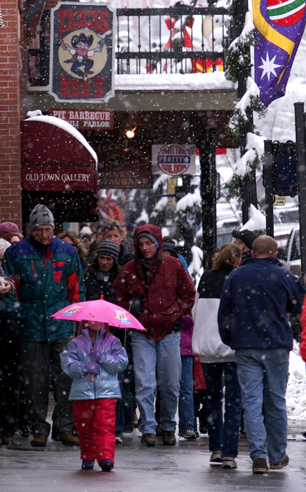Snow falls in a file photo of Park City, Utah, where Los Angeles Mayor Eric Garcetti plans to attend the Sundance Film Festival.