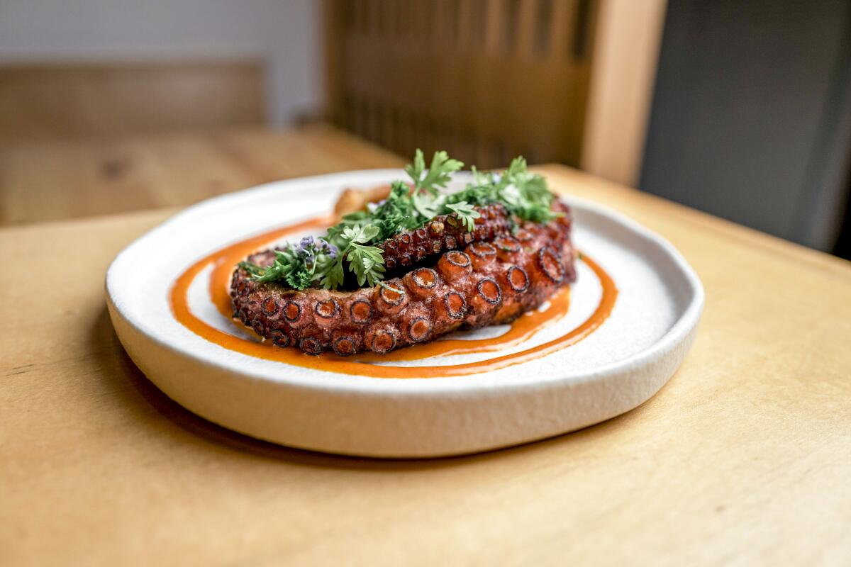 Octopus with gochujang aioli and herbs.