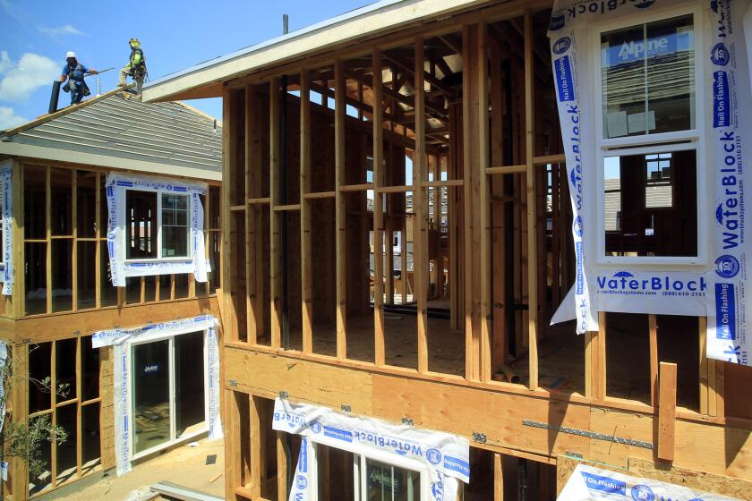 Homes under construction in Irvine on Aug. 19.
