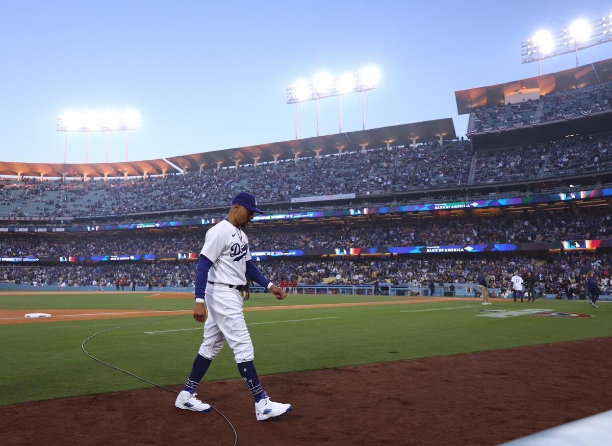Dodgers right fielder Mookie Betts walks to the dugout at Dodger Stadium.