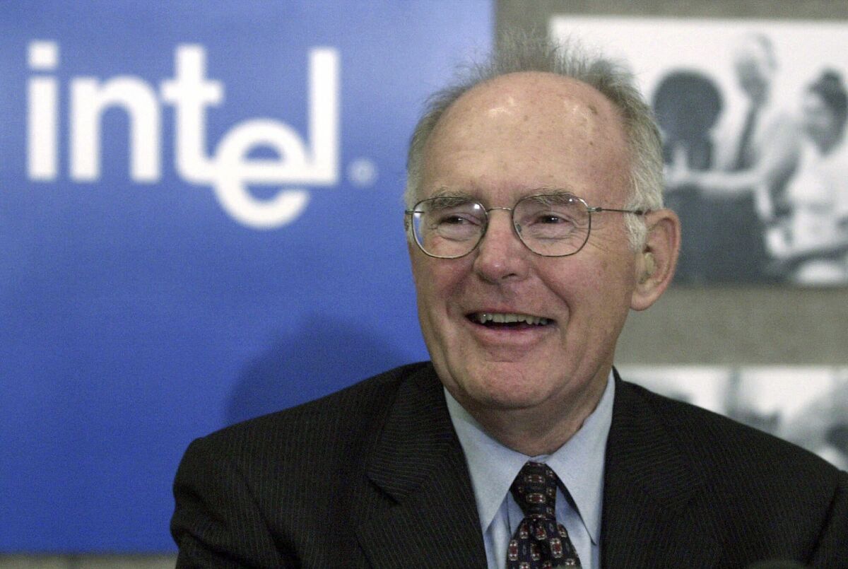 FILE - Gordon Moore, the legendary Intel Corp. co-founder who predicted the growth of the semiconductor industry, smiles during a news conference, Thursday, May 24, 2001, in Santa Clara, Calif. Moore, the Intel Corp. co-founder who set the breakneck pace of progress in the digital age with a simple 1965 prediction of how quickly engineers would boost the capacity of computer chips, has died. He was 94. Intel and the Gordon and Betty Moore Foundation say Moore died Friday, March 24, 2023 at his home in Hawaii. (AP Photo/Ben Margot, File)