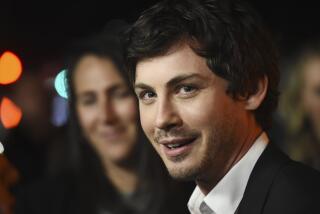 Logan Lerman, a cast member in the Amazon Prime Video series "Hunters," poses at the premiere of the show at the Directors Guild of America, Wednesday, Feb. 19, 2020, in Los Angeles. (AP Photo/Chris Pizzello)