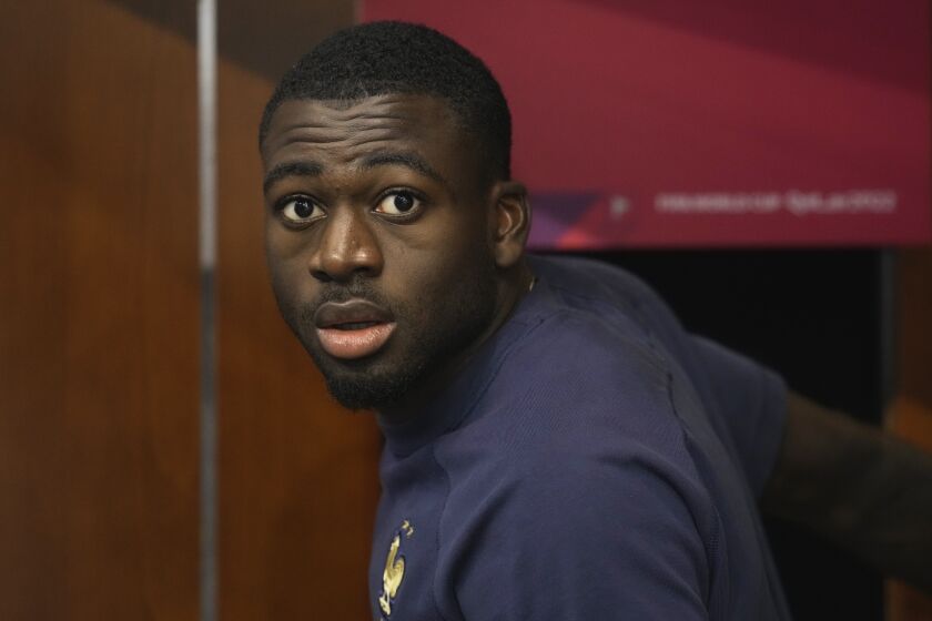 France's Youssouf Fofana arrives for a press conference at the Jassim Bin Hamad stadium in Doha, Qatar, Thursday, Dec. 8, 2022. France will play against England during their World Cup quarter-final soccer match on Dec. 10. (AP Photo/Christophe Ena)