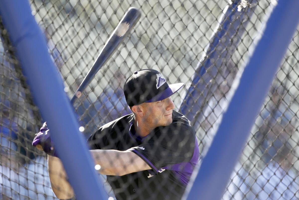 Colorado Rockies' Troy Tulowitzki hits in the batting cage on June 16.