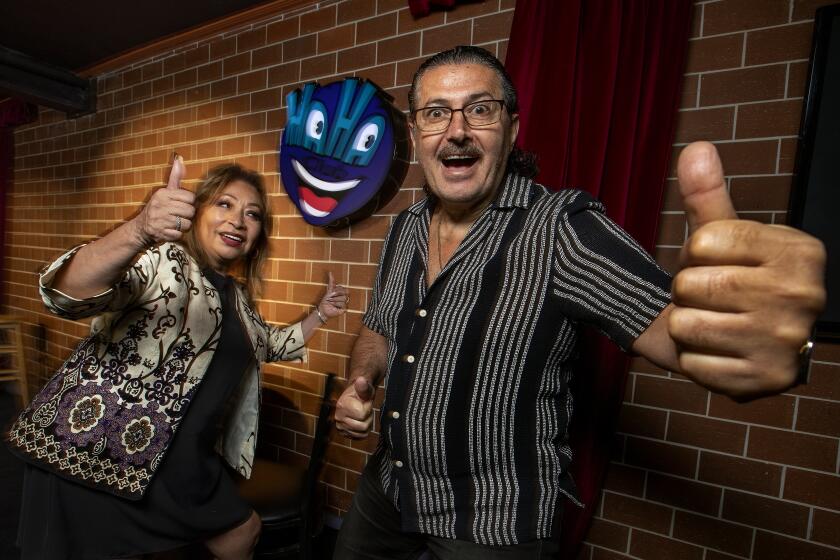 NORTH HOLLYWOOD, CA-AUGUST 2, 2023:Tere Assadourian and her husband Jack, owners of the Haha Comedy Club on Lankershim Blvd. in North Hollywood, are photographed inside the showroom. Haha Comedy Club, one of the few mom and pop-run comedy clubs in L.A., is celebrating its 35th year anniversary. (Mel Melcon / Los Angeles Times)