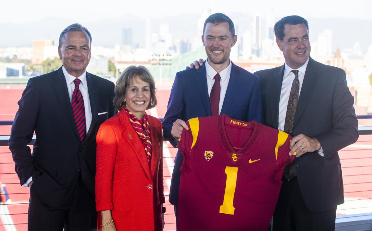 USC President Carol Folt stands with Rick Caruso, Lincoln Riley and Mike Bohn.