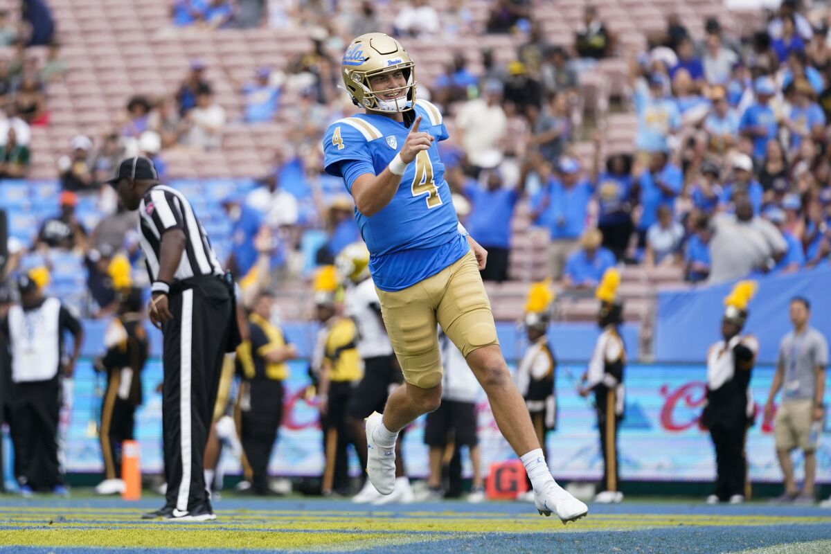UCLA quarterback Ethan Garbers celebrates after scoring a touchdown against Alabama State on Sept. 10.
