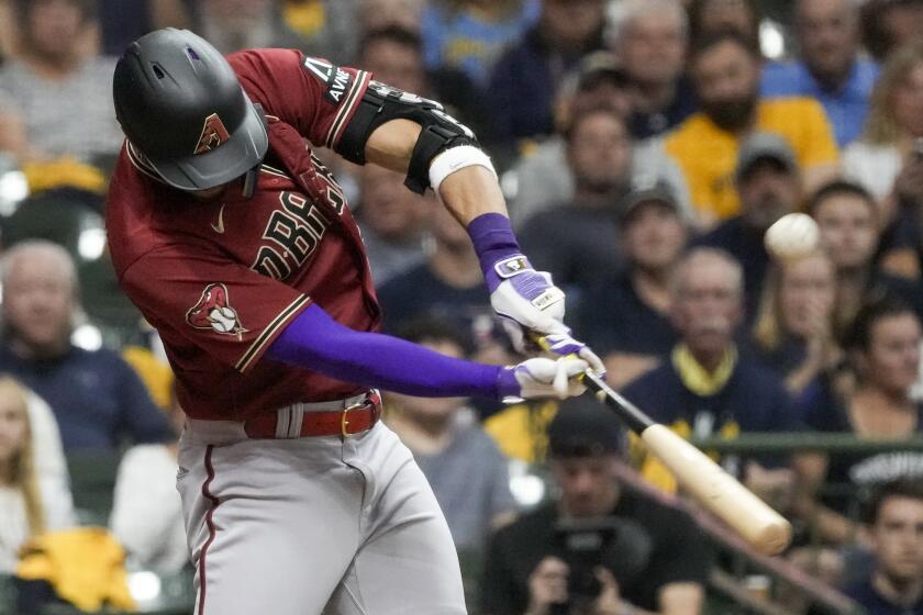 Arizona Diamondbacks' Lourdes Gurriel Jr. hits an RBI single during the sixth inning of a Game 2 of their National League wildcard baseball series against the Milwaukee Brewers Wednesday, Oct. 4, 2023, in Milwaukee. (AP Photo/Morry Gash)