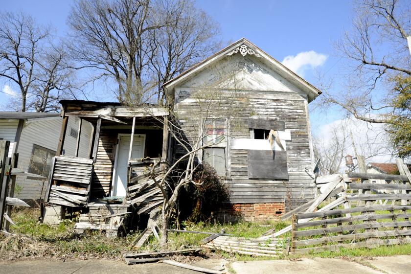 A partially collapsed home stands in Selma, Ala., on Thursday, Feb. 24, 2022. Despite being known worldwide as a beacon of voting rights, the city and surrounding Dallas County had one of the worst voter turnouts in Alabama for the 2020 presidential election, and some are trying to increase voter participation. (AP Photo/Jay Reeves)