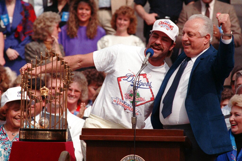 Los Angeles Dodgers outfielder Kirk Gibson, left, hams it up with manager Tommy Lasorda.