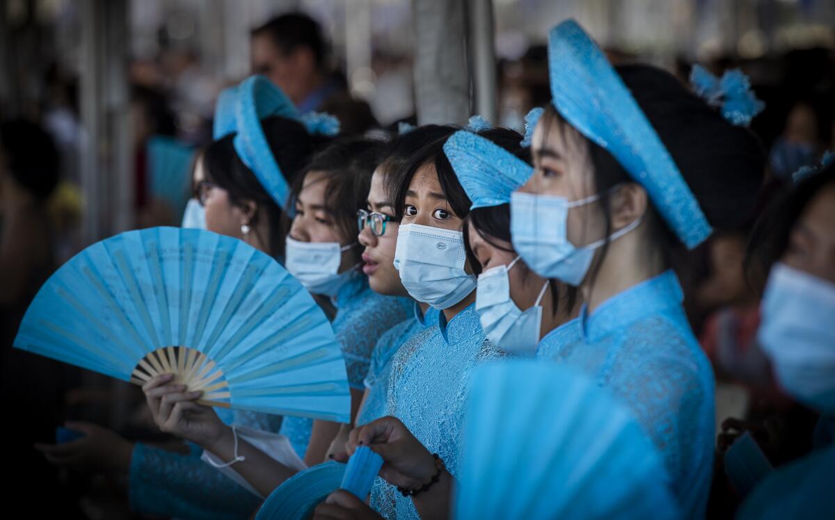 Young people at Christ Cathedral in Garden Grove wear face masks 