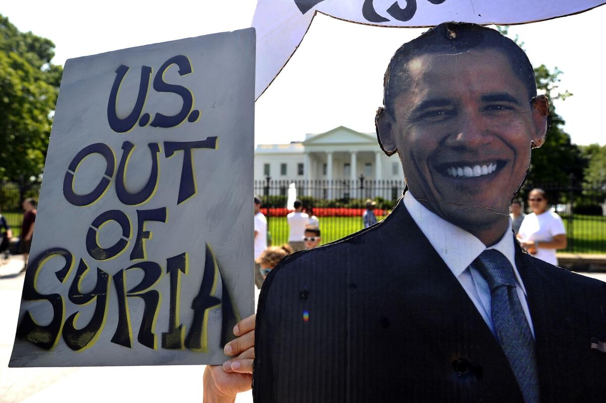Anti-war demonstrators protest in front of the White House.