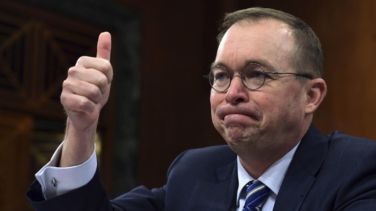 Mick Mulvaney took his seat before a congressional committee April 11 for the first time since his appointment to be the nation’s top consumer financial watchdog.
