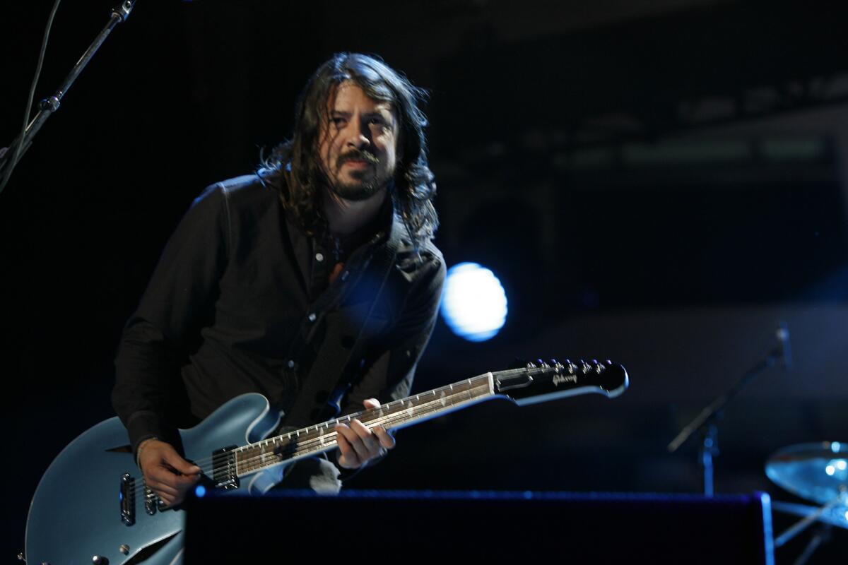 Dave Grohl is to slated to team up with Lindsey Buckingham, Queens of the Stone Age and Nine Inch Nails for a performance on Sunday's Grammy Awards, organizers announced.