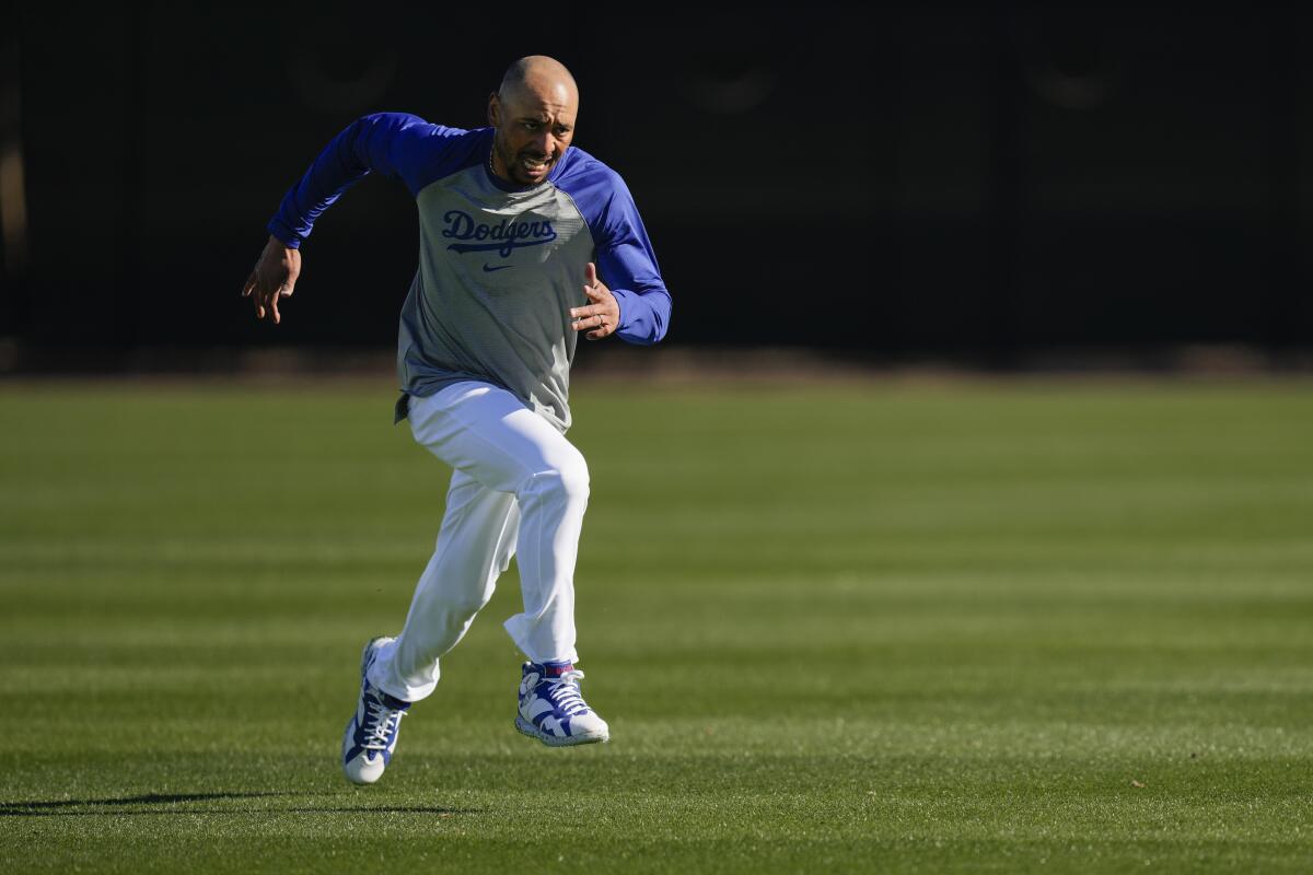 Dodgers star Mookie Betts runs sprints during spring training at Camelback Ranch in Phoenix.