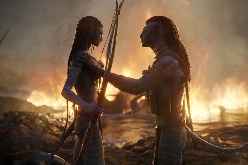 A blue, CGI woman holding a bow and arrow while interacting with a blue, CGI man in a fiery landscape