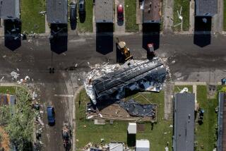 A storm damaged mobile home rests in the street at Pavilion Estates mobile home park just east of Kalamazoo, Mich. Wednesday, May 8, 2024. A tornado ripped through the area the evening of May 7. (Neil Blake/The Grand Rapids Press via AP)