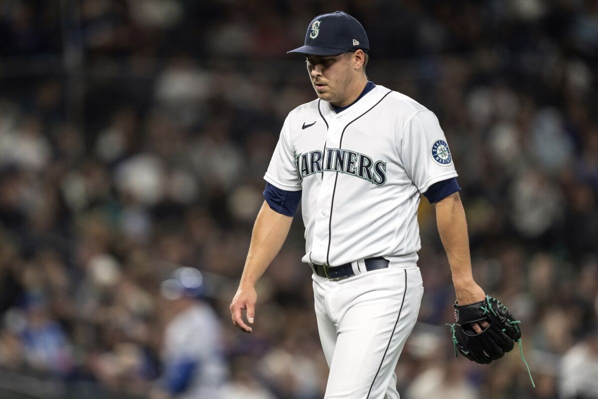 FILE - Seattle Mariners reliever Erik Swanson walks off the field after pitching during a baseball game against the Kansas City Royals, on April 23, 2022, in Seattle. Swanson was placed on the 15-day injured list Saturday, May 14, 2022, with right elbow inflammation, leaving the team without one of its top arms in the bullpen. (AP Photo/Stephen Brashear, File)