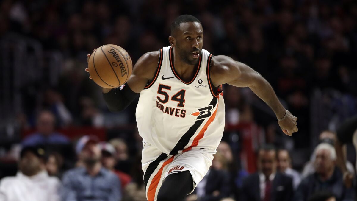 Clippers forward Patrick Patterson controls the ball during a game.