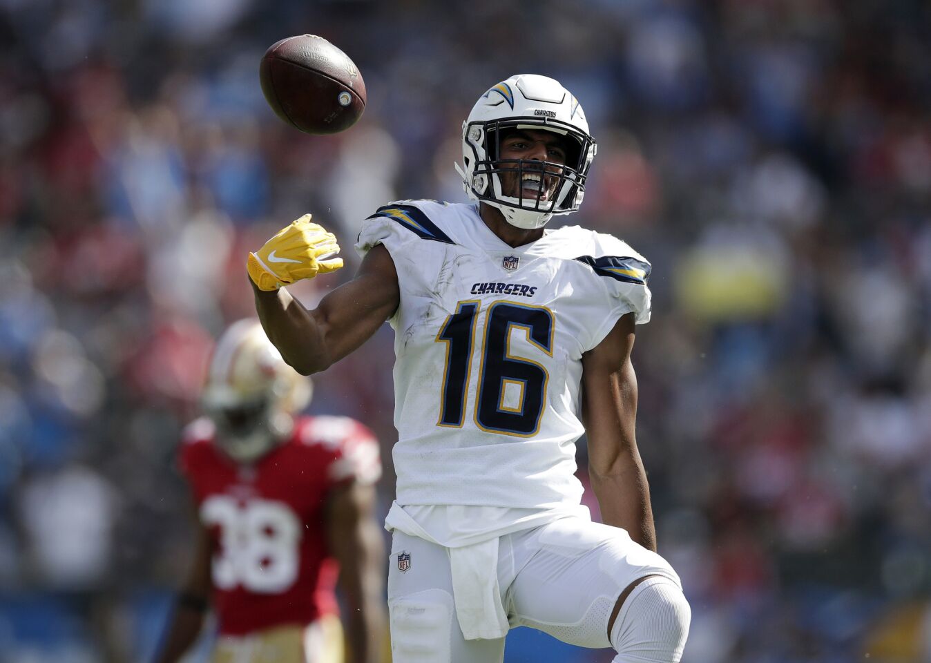Los Angeles Chargers wide receiver Tyrell Williams, right, celebrates a catch as San Francisco 49ers defensive back Antone Exum stands in the background during the second half of an NFL football game, Sunday, Sept. 30, 2018, in Carson, Calif.