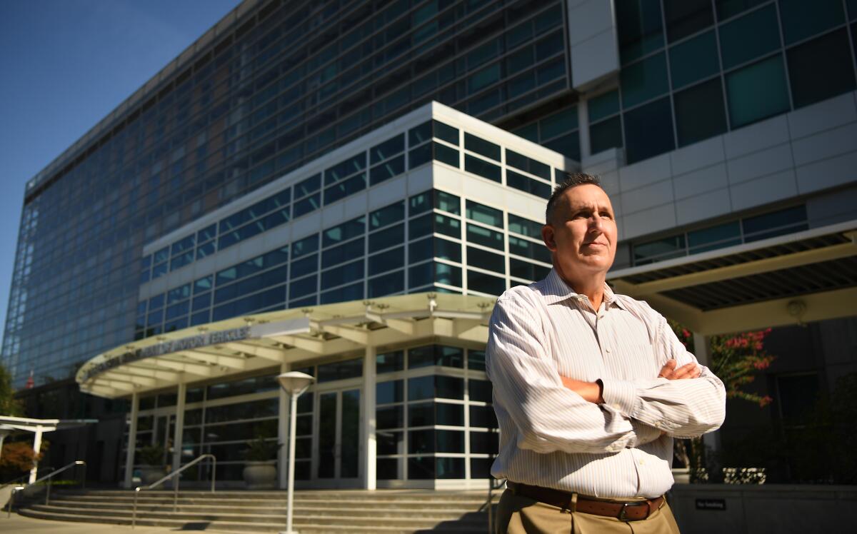 DMV director Steve Gordon stands outside the department headquarters in Sacramento in 2019.