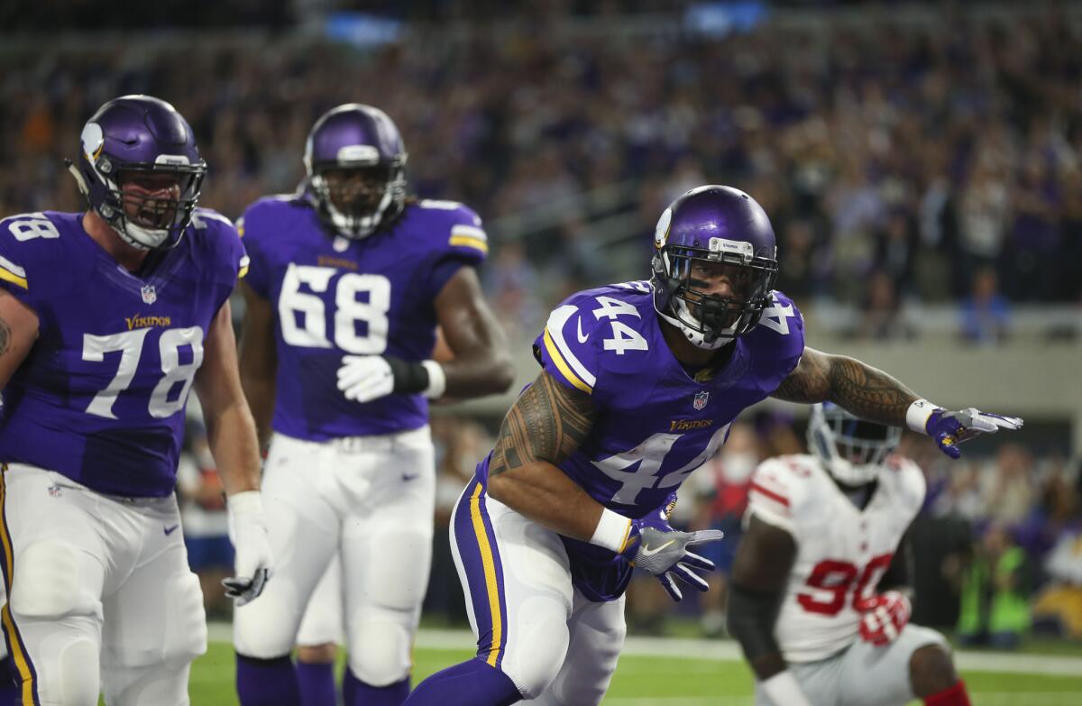 Vikings running back Matt Asiata celebrates his one-yard touchdown run in the first quarter.