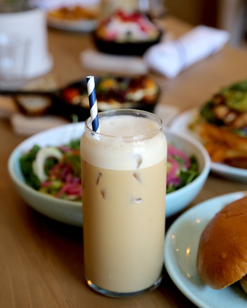 The Draft Flat White with oat milk coffee from Bluestone Lane, an Australian coffee shop in Orange.