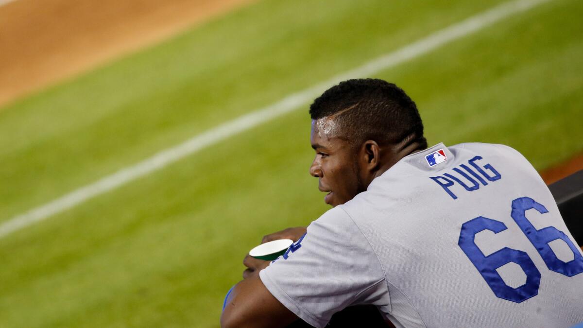 Dodgers right fielder Yasiel Puig, who was injured at the end of Sunday's loss to the Miami Marlins, complained of dizziness and headaches after riding a stationary bike Monday.