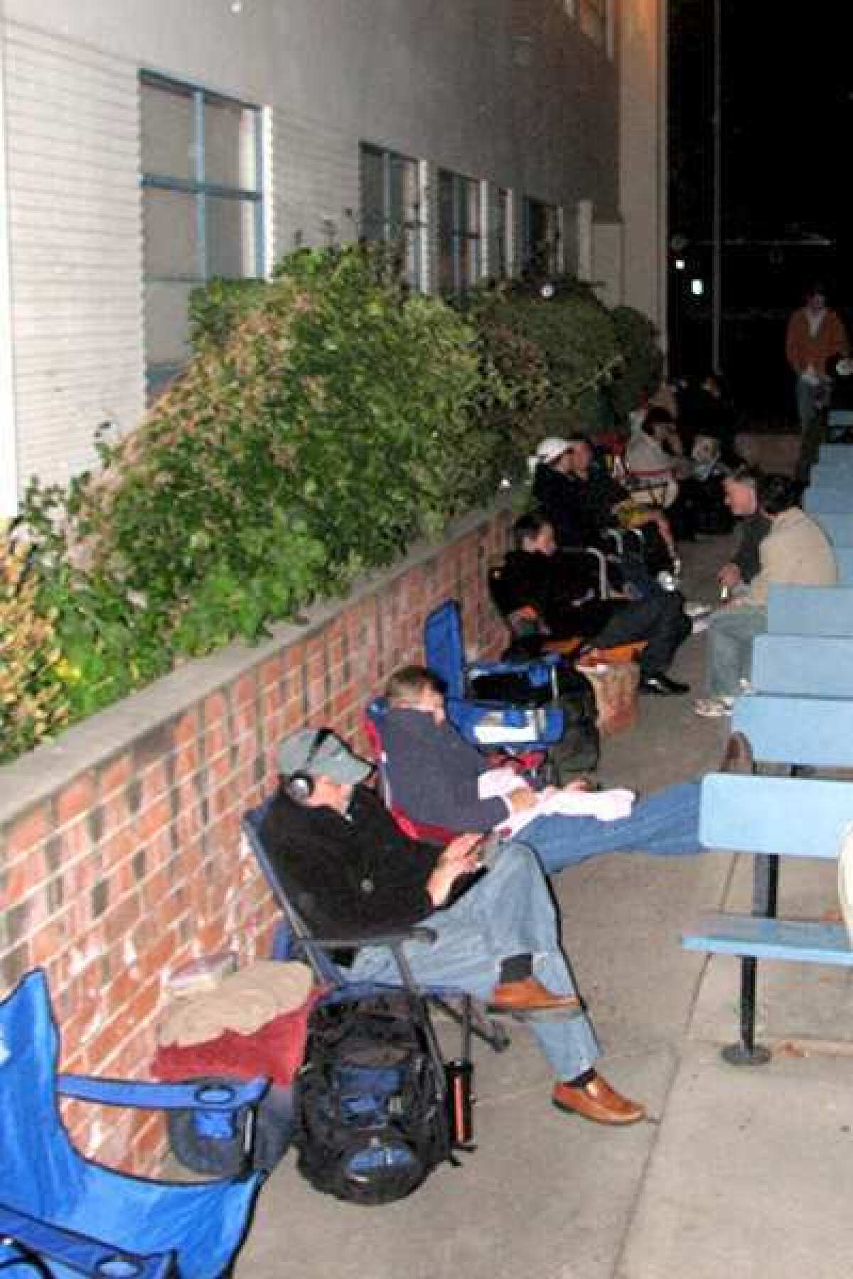 ARCHIVE PHOTO: Parents hoping to enroll their children in LCUSD schools camped outside district headquarters.