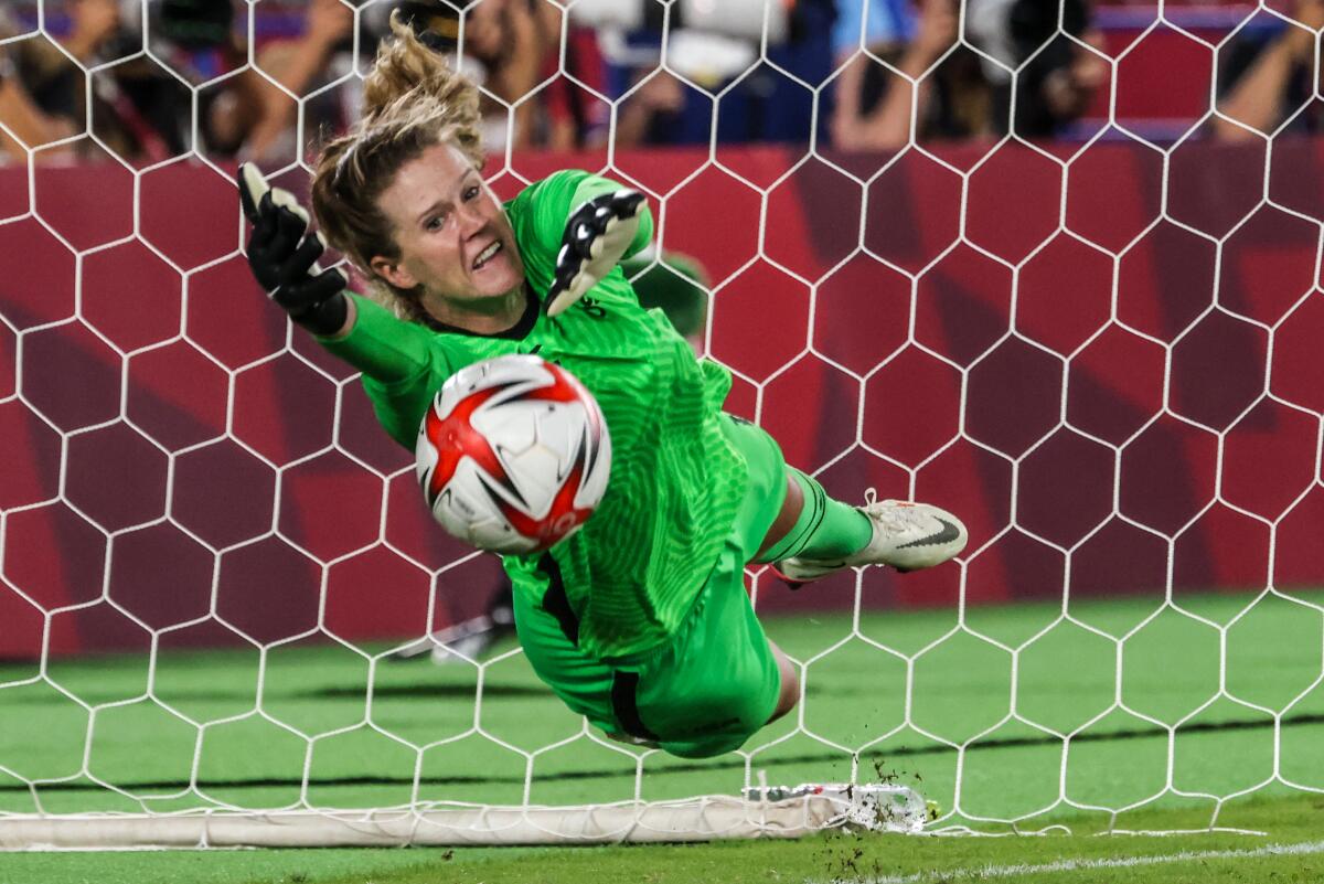 American goalkeeper Alyssa Naeher makes a save against Netherlands forward Vivianne Miedema,